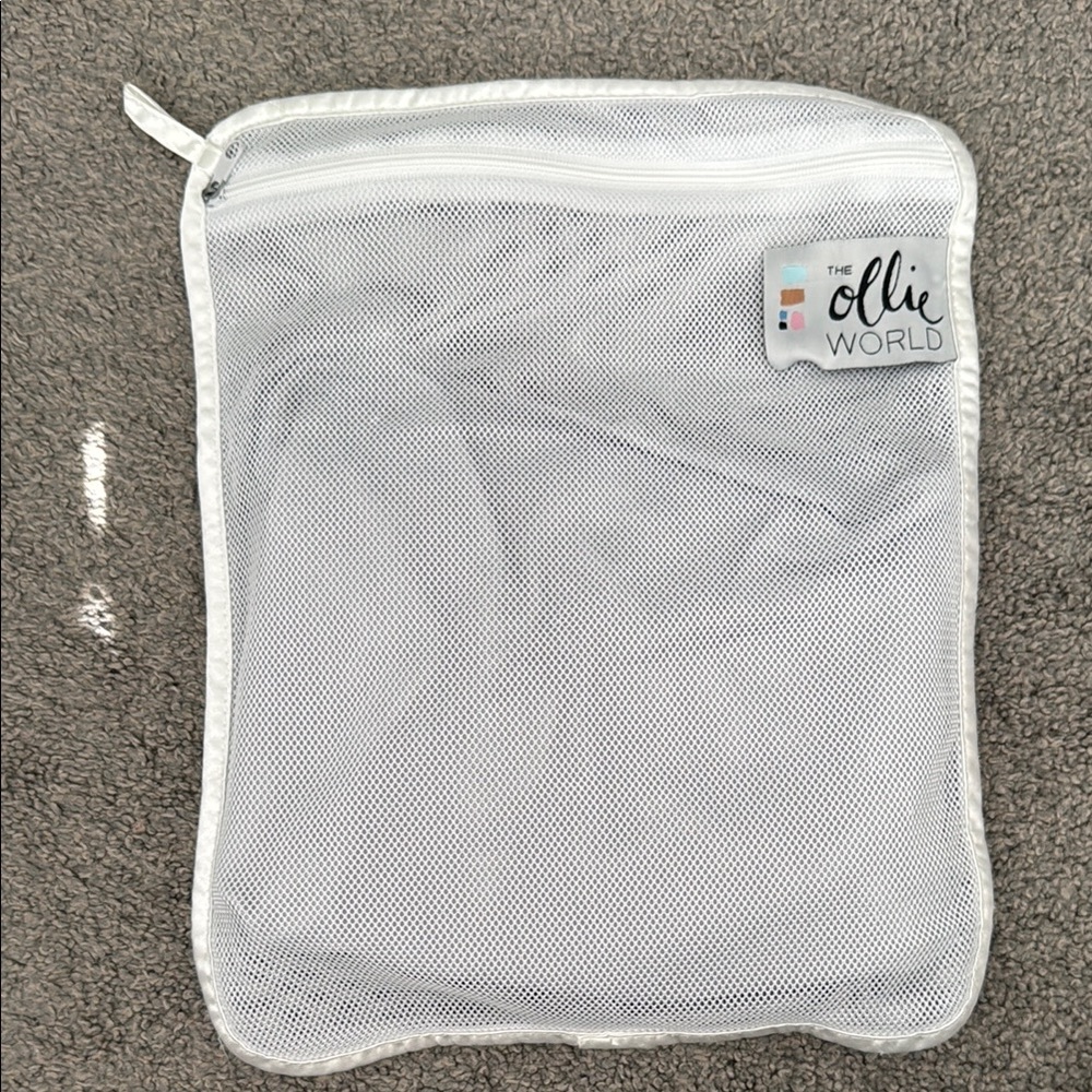 The Ollie World Swaddle in Grey + White Mesh Laundry Bag